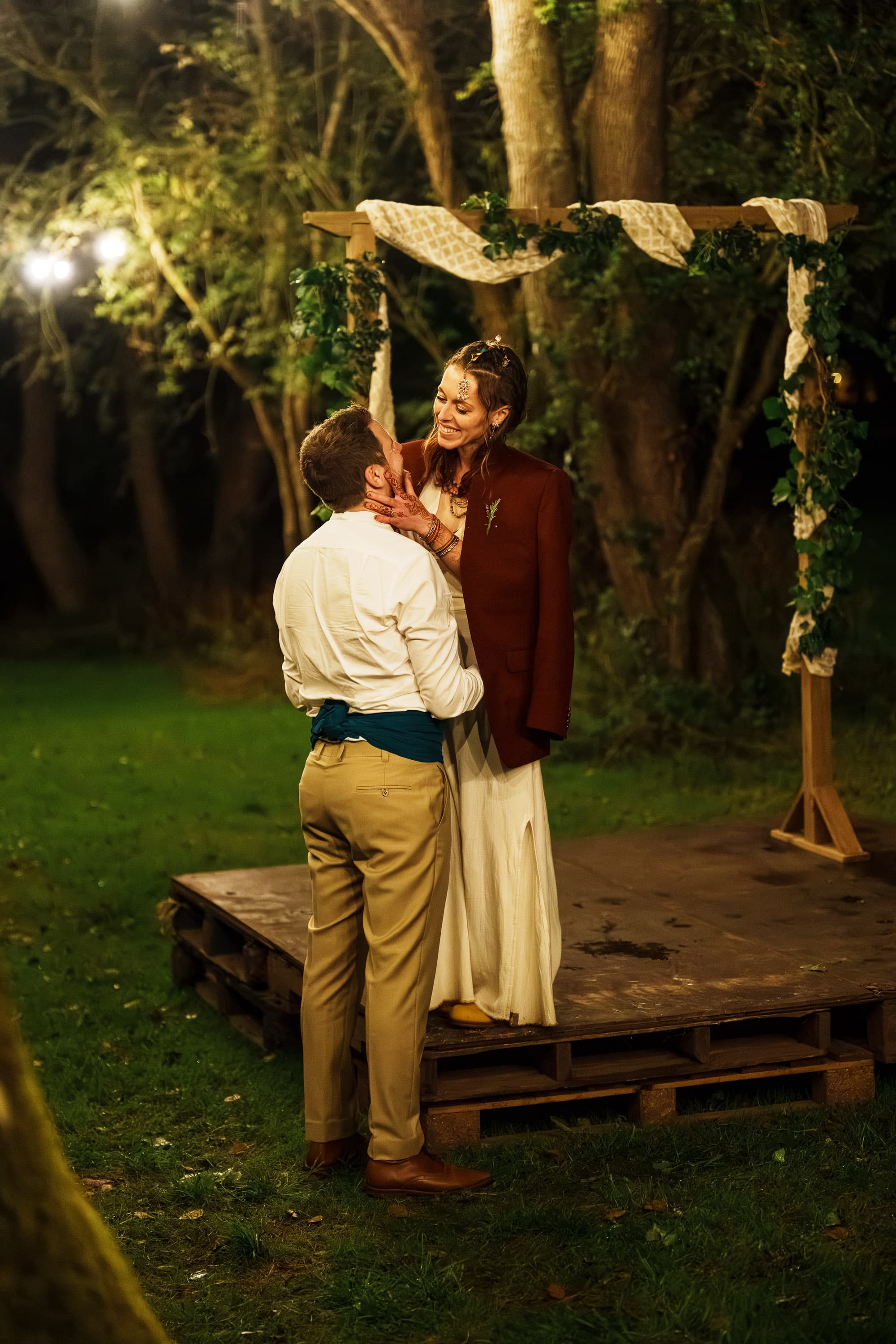 Adam and Sarah holding each other in the final quiet after the wedding has fully fallen away.
