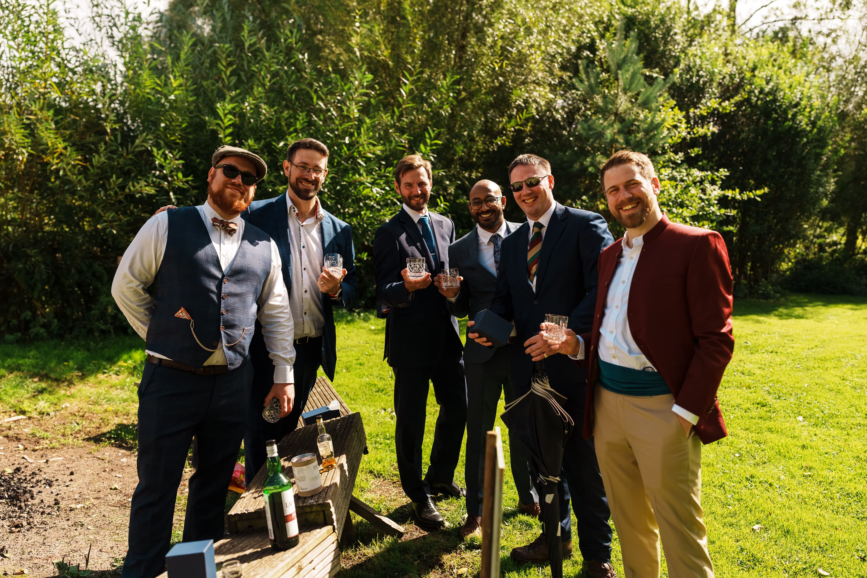 Adam standing with close friends as the social energy gathers before the vows.