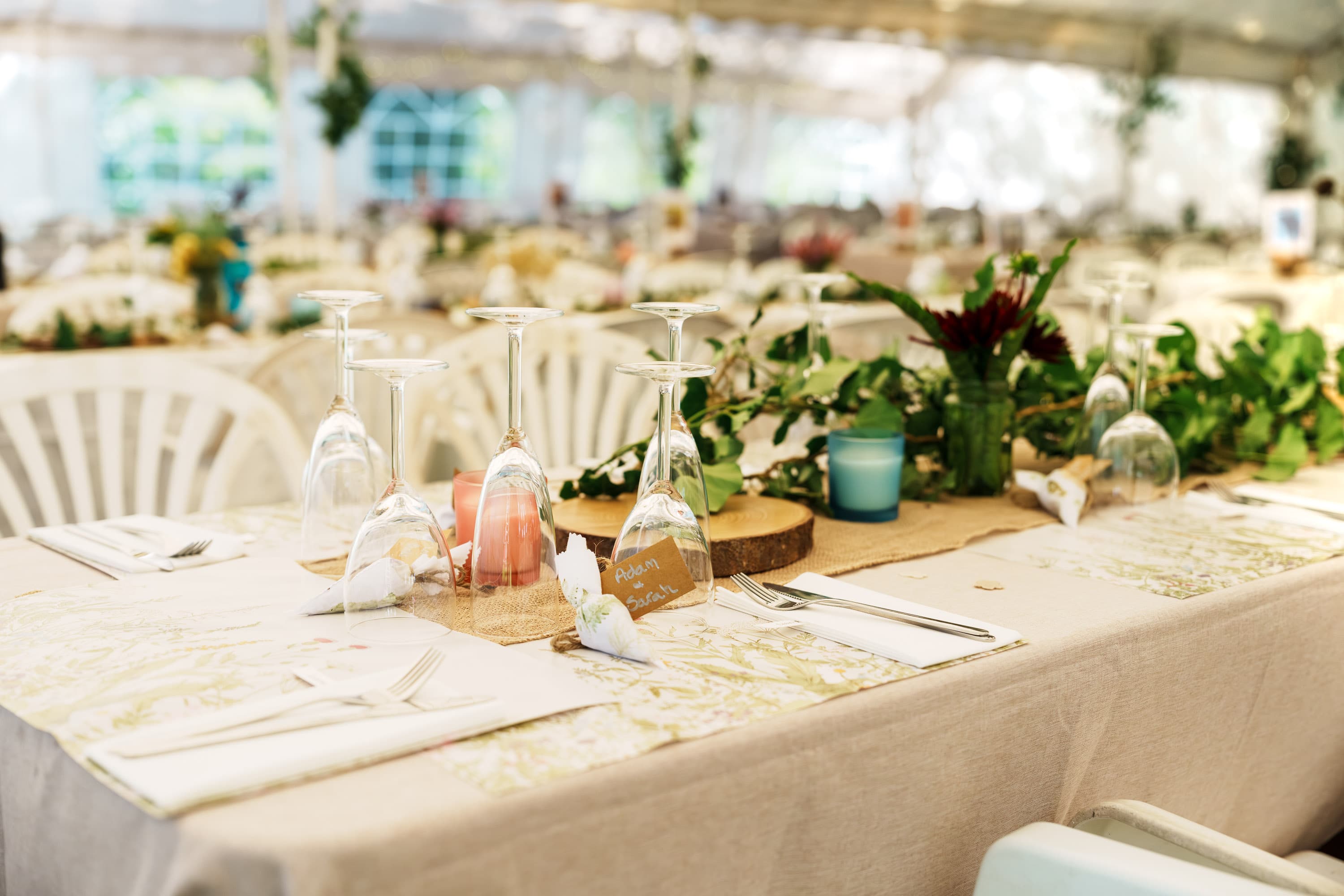 Table settings prepared in the tent before the meal and speeches begin later in the day.