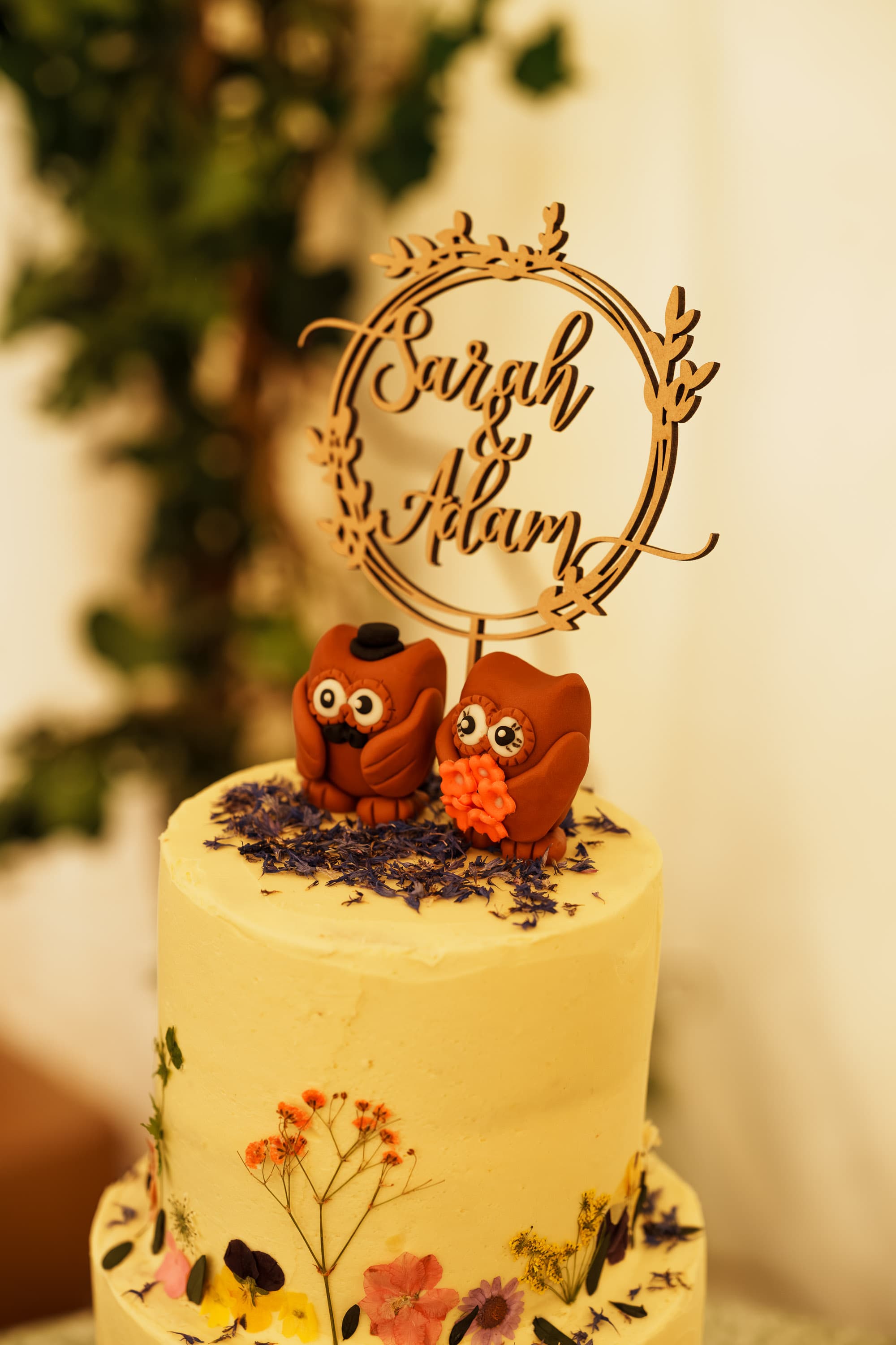 The wedding cake waiting as a symbolic centerpiece before the cutting begins.
