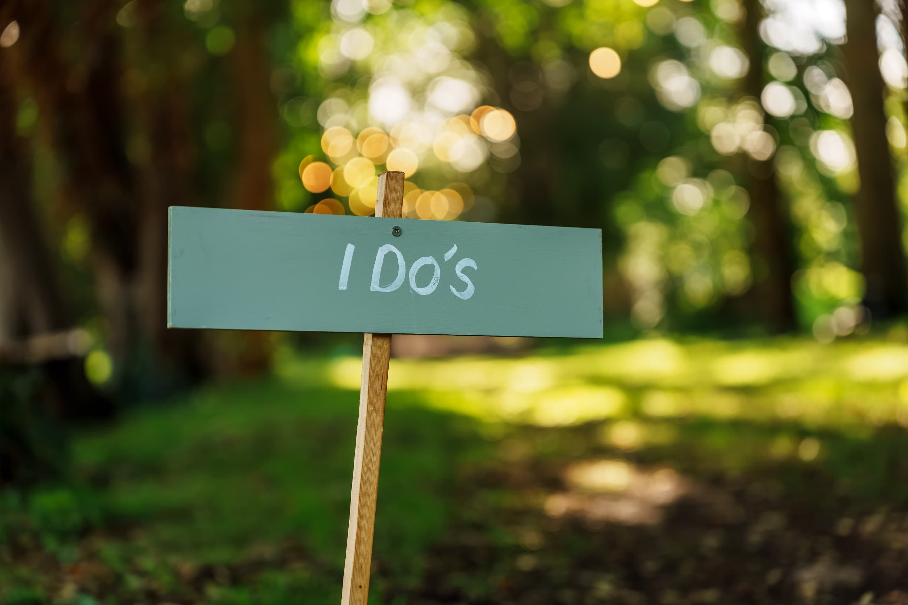 An 'I Do's' sign carrying the ceremony language forward into the evening.
