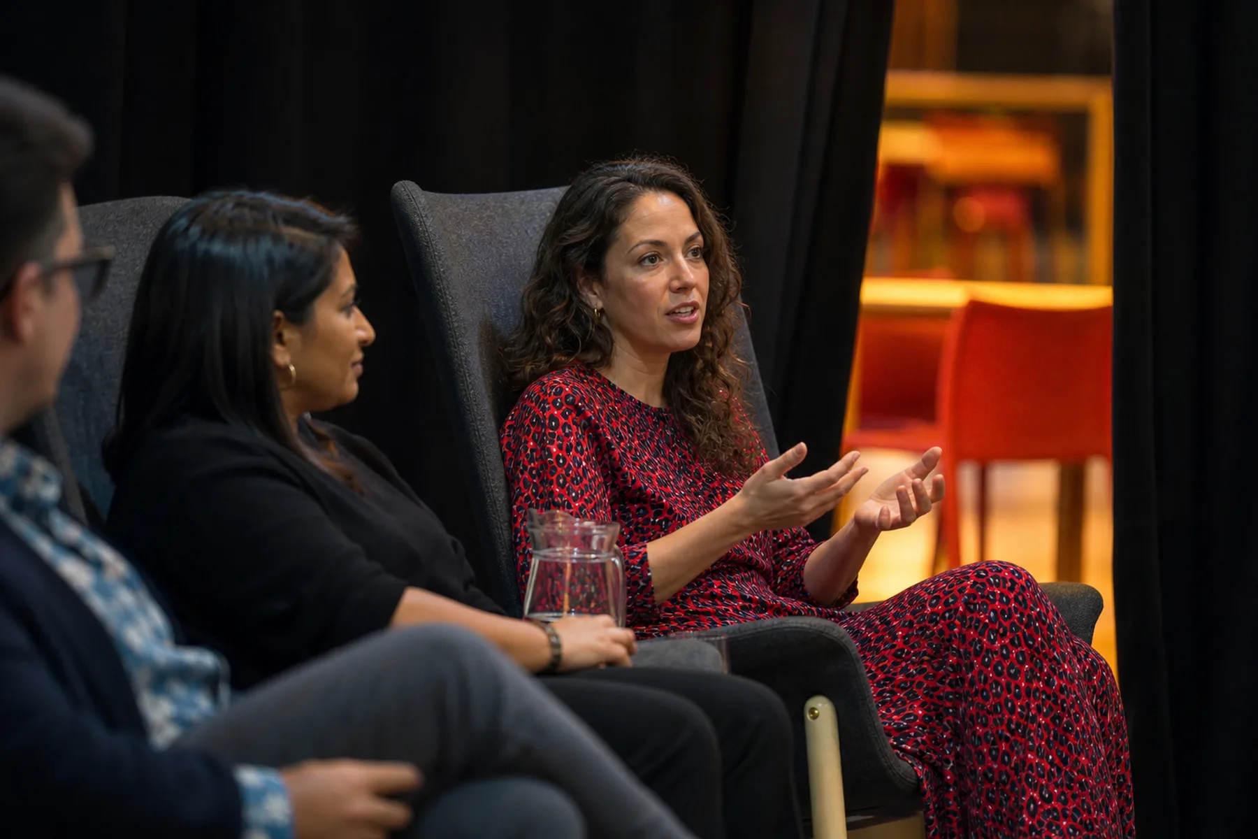 An audience listening moment during a commercial event talk.