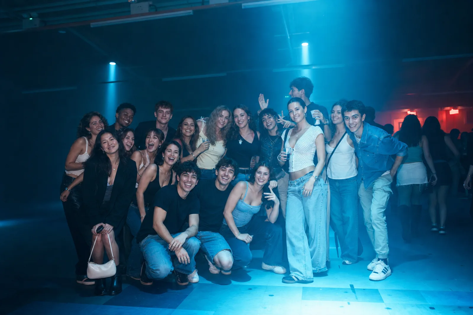 A low-light portrait made in a fast-moving nightlife environment.