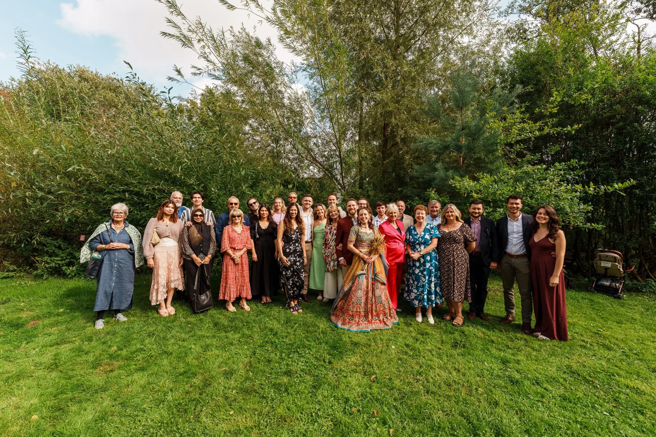 A larger group portrait showing how fully the wedding is held by friends and family.